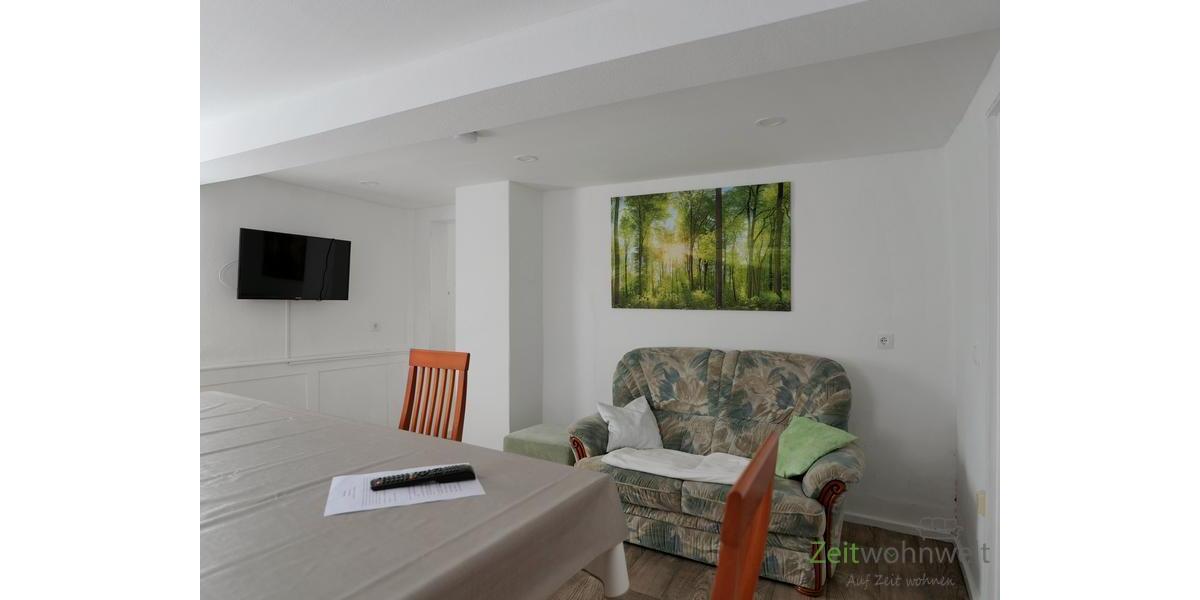 EG, TV und Sofa im Esszimmer